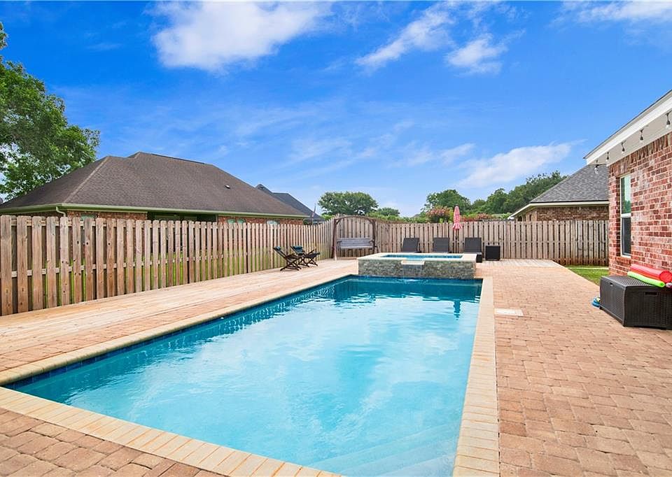Wide view of the private backyard pool at 28110 Annabelle Lane