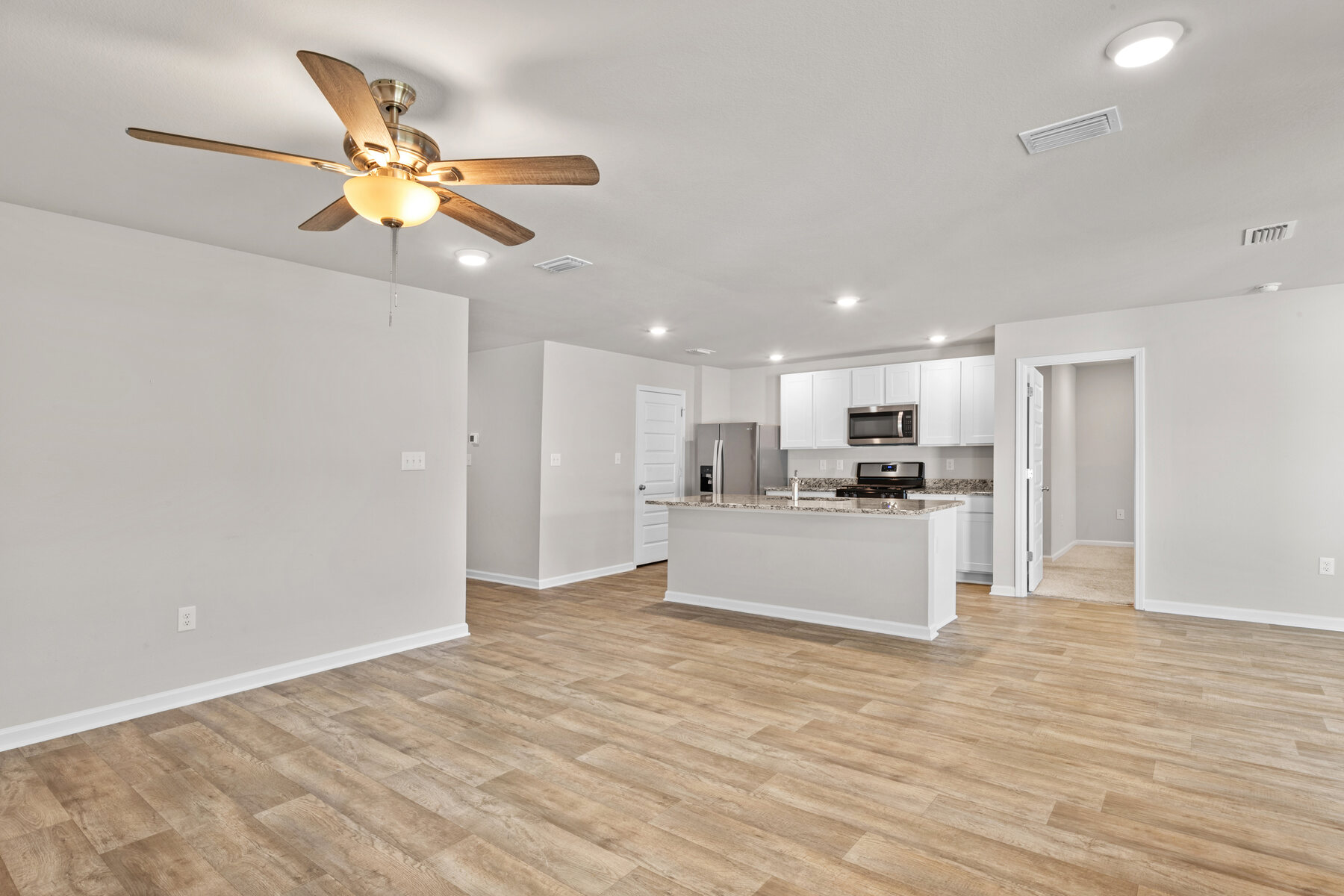 Open-plan living and kitchen at 24061 Citation Loop